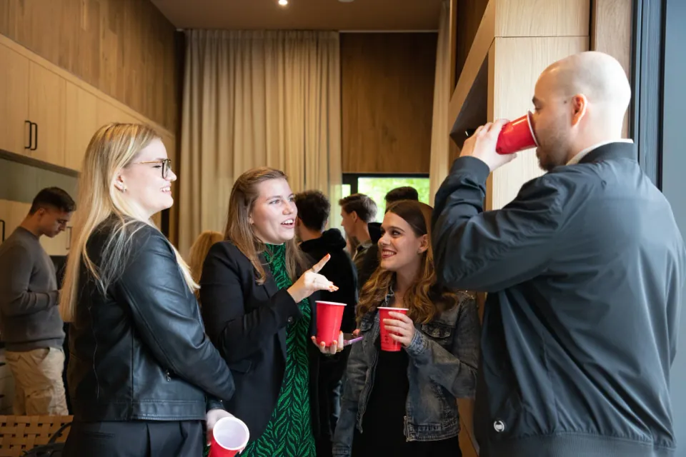 Guests in conversation at an indoor party
